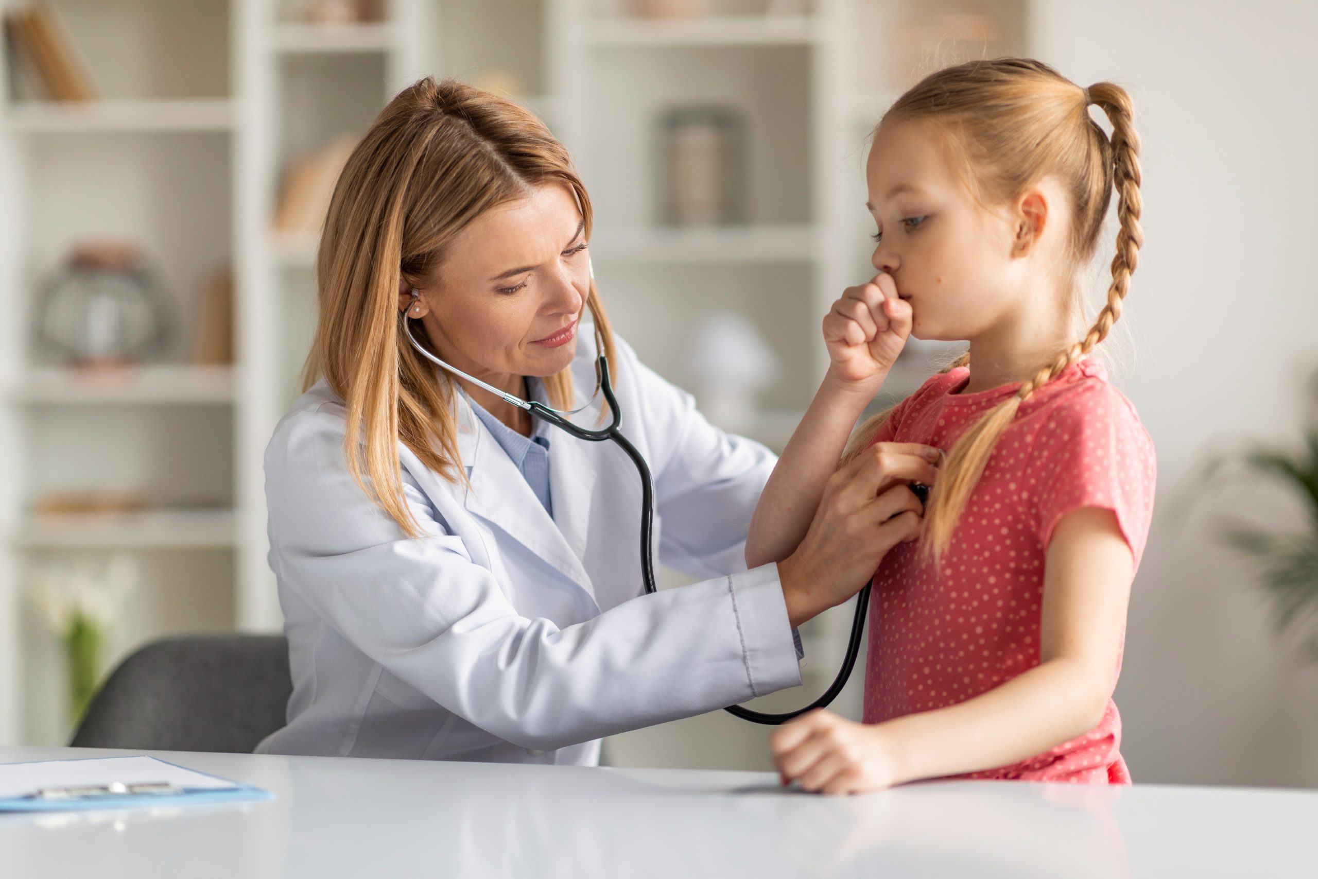 Pediatrician,Lady,With,Stethoscope,Listening,Lungs,Of,Coughing,Little,Girl