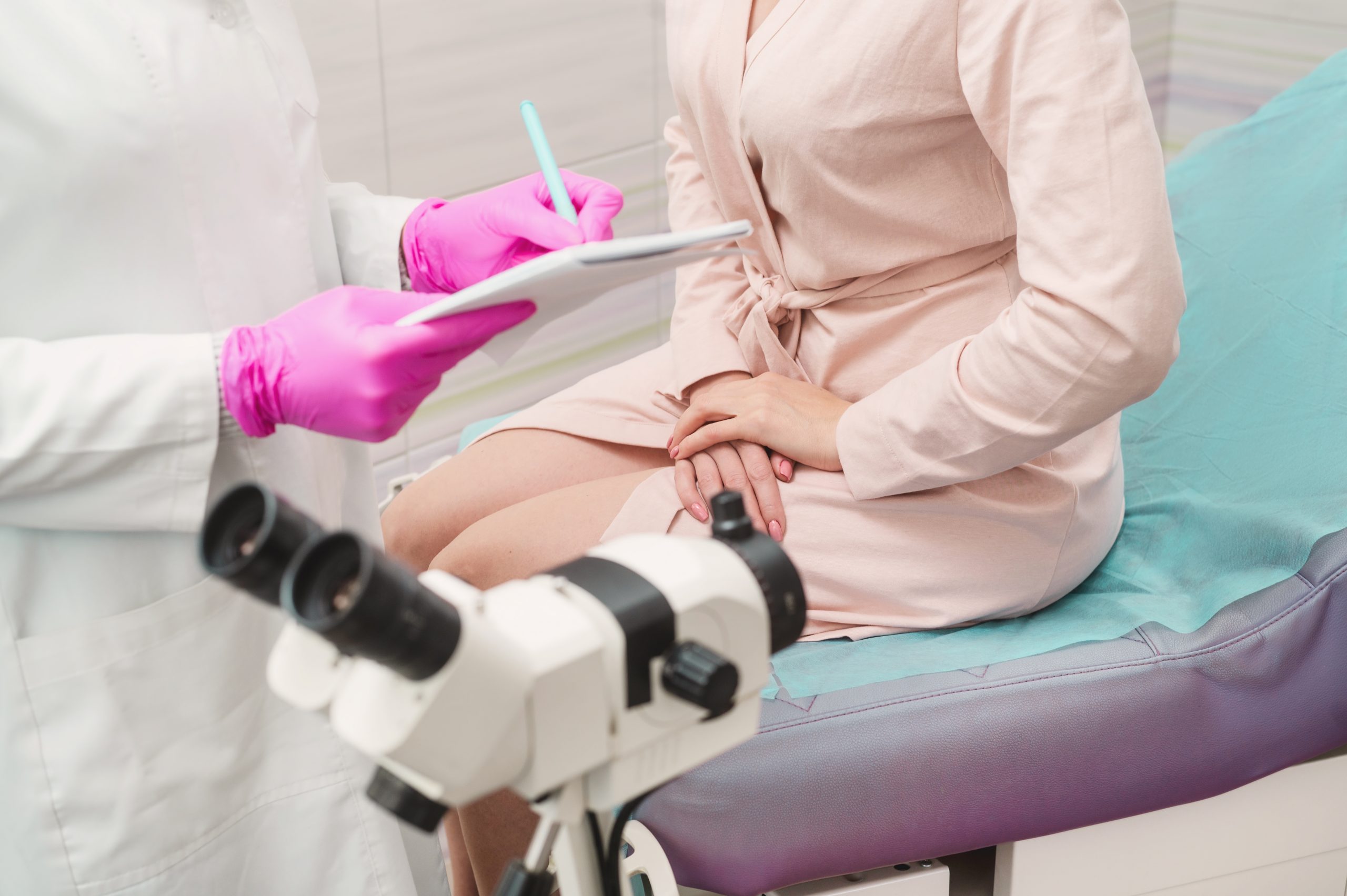 A,Young,Woman,In,A,Hospital,Gown,At,A,Gynecologist's