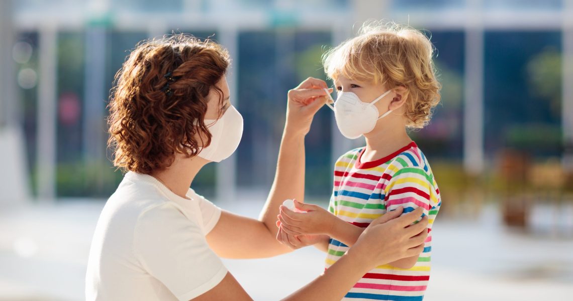 Family,With,Kids,In,Face,Mask,In,Shopping,Mall,Or