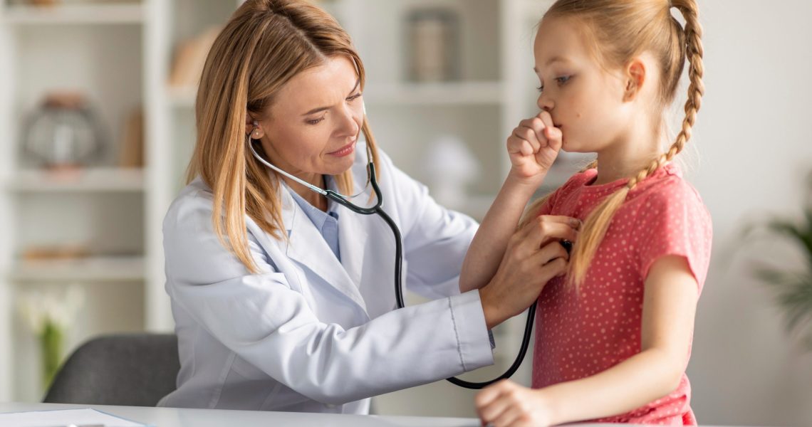 Pediatrician,Lady,With,Stethoscope,Listening,Lungs,Of,Coughing,Little,Girl
