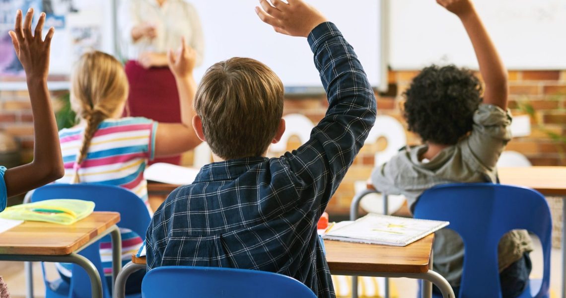 Education,,Question,With,Group,Of,Children,In,Classroom,And,Raise