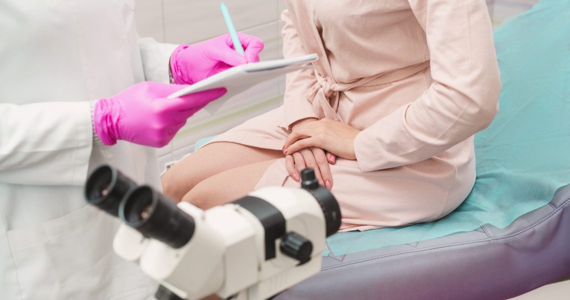 A,Young,Woman,In,A,Hospital,Gown,At,A,Gynecologist's