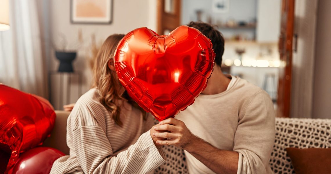 Happy,Valentine's,Day.,Young,Couple,In,Love,Holding,A,Heart-shaped