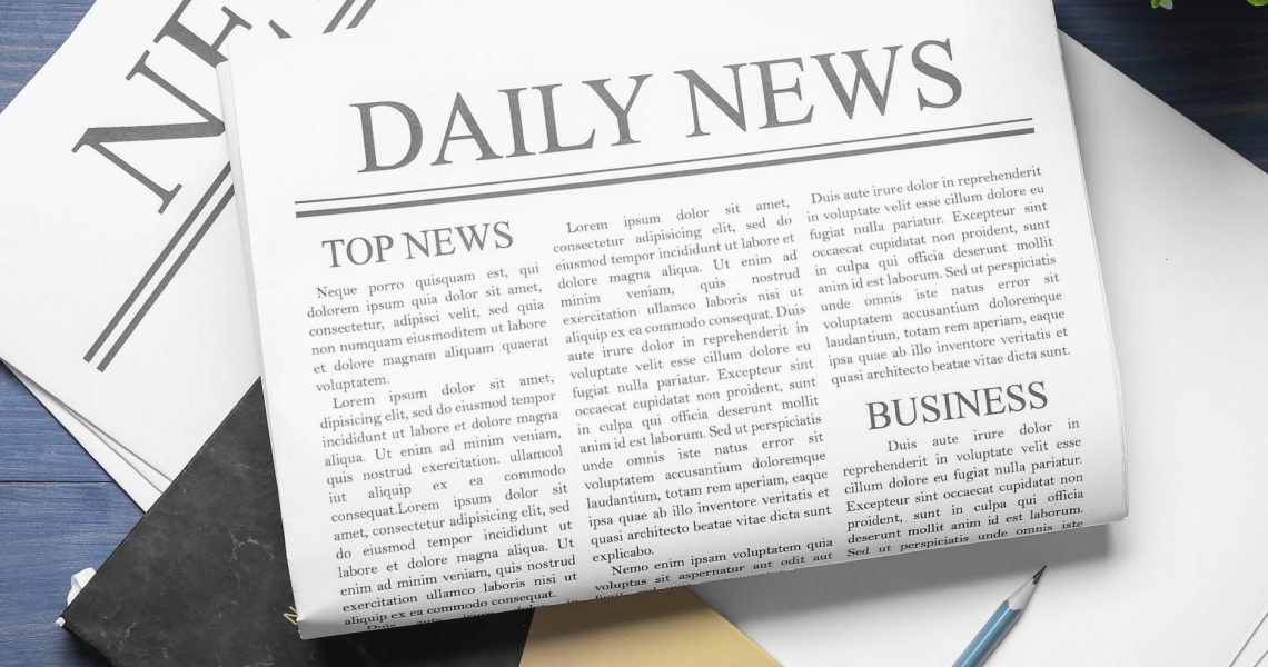 Newspapers,With,Notebook,And,Pencil,On,Blue,Wooden,Background