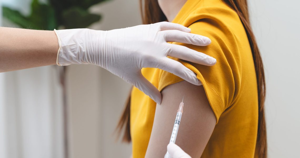 People,Getting,A,Vaccination,To,Prevent,Pandemic,Concept.,Woman,In