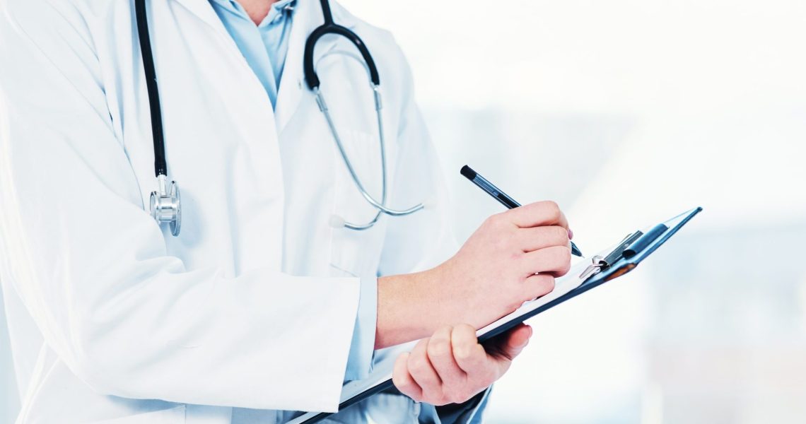 Hands,,Doctor,And,Clipboard,Writing,Notes,For,Hospital,Schedule,,History