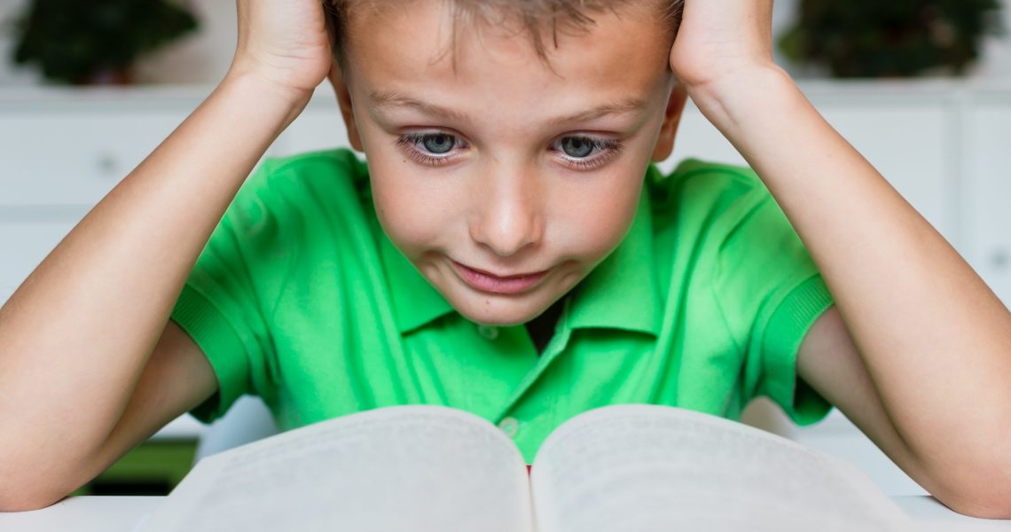 Young,Boy,In,Green,Polo,Shirt,Having,Serious,Learning,Difficulties